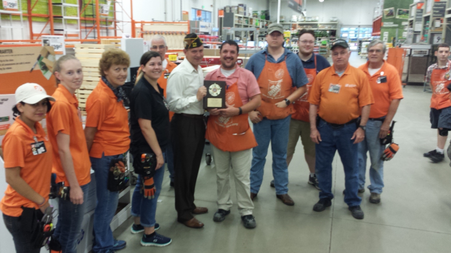 Presented a plaque to Home Depot for their donation of a BBQ Grill for a donation.